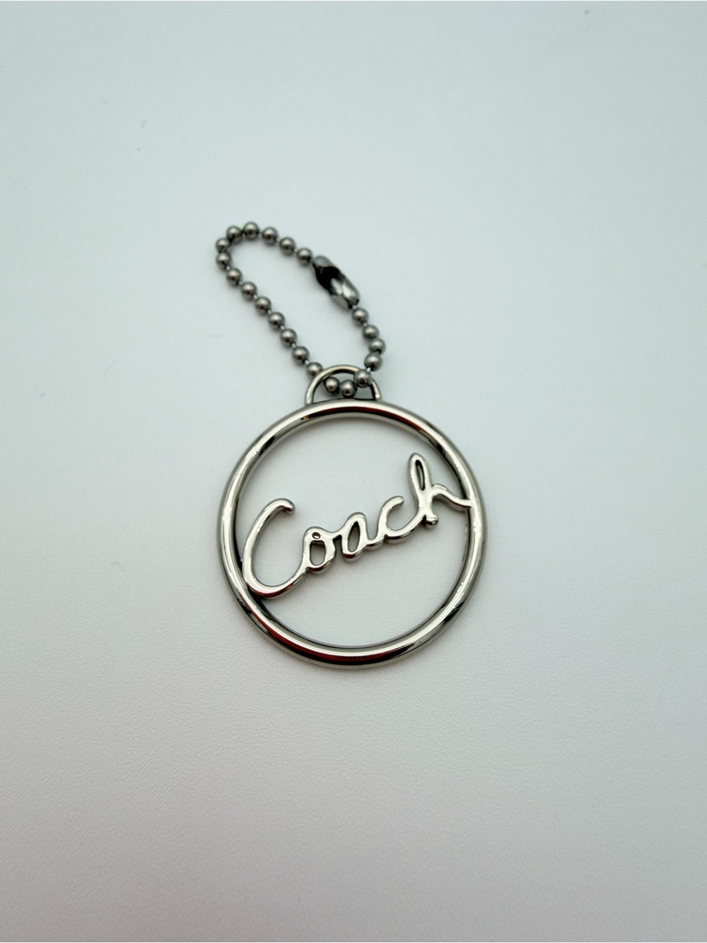Coach Silver Script Circle Charm - Silver 1 1/4”